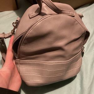 small grey mini backpack